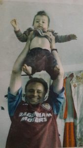 Pete May in 1999, lifts daughter Lola as if she is the FA Cup. (c) Islington Faces